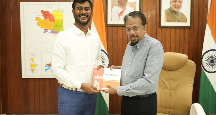 Josan Ranjith presenting the book to Honorable Lituenant Governor of Pondicherry Shri.K. Kailashnathan IAS Retd