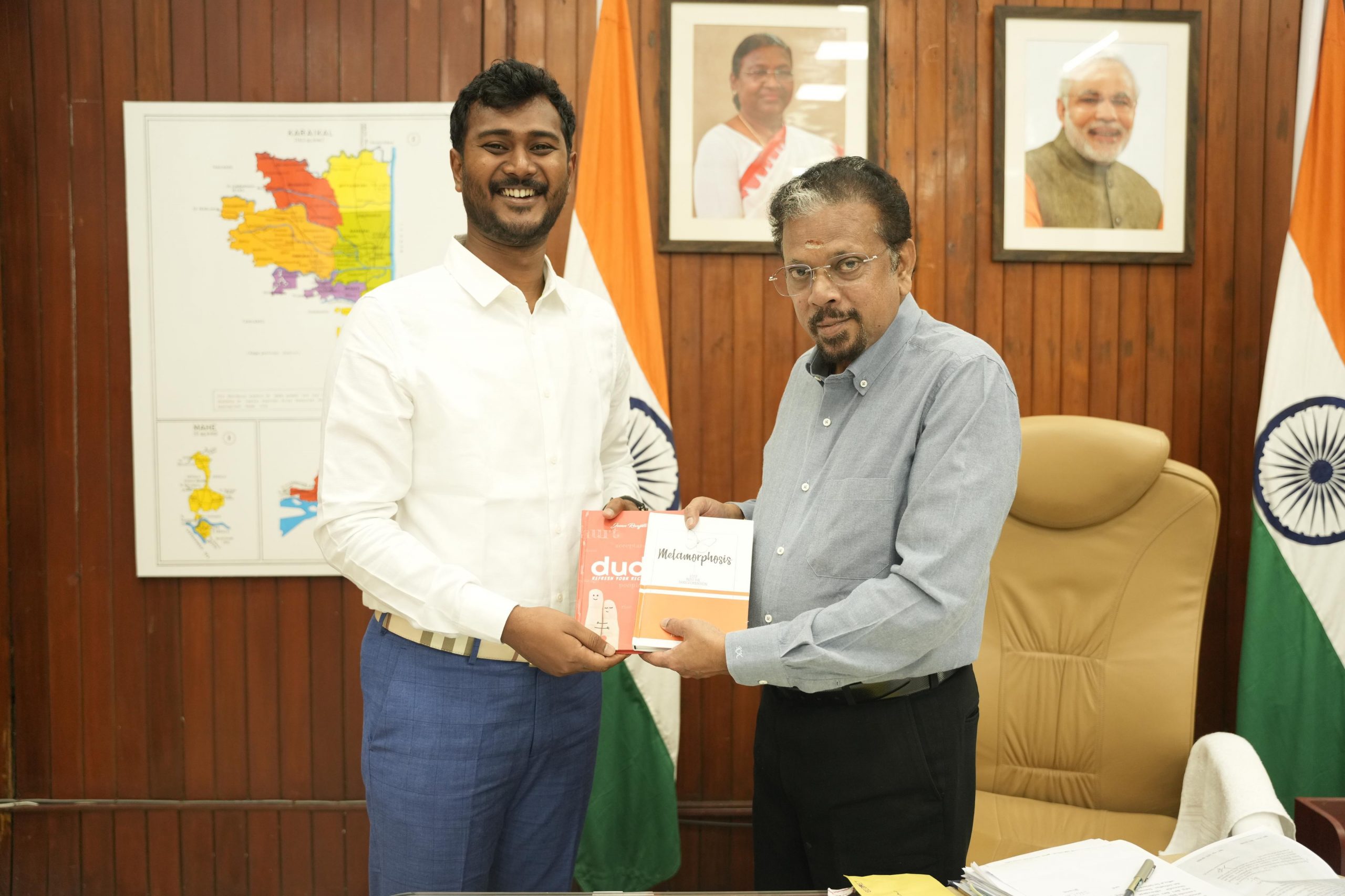 Josan Ranjith presenting the book to Honorable Lituenant Governor of Pondicherry Shri.K. Kailashnathan IAS Retd